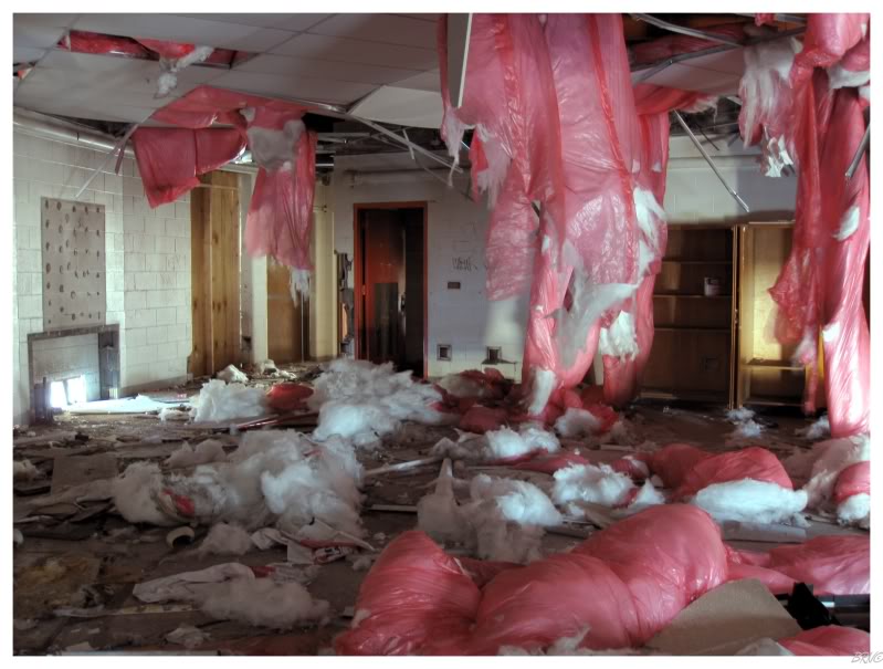 empty classroom with pink styrofoam hanging from the ceiling