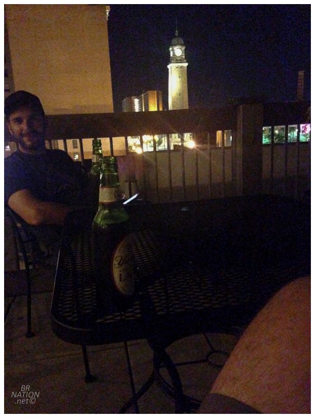 clarkman on the hostel roof with yuengling